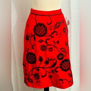 Elegant Red A-Line Skirt with Black Floral Design